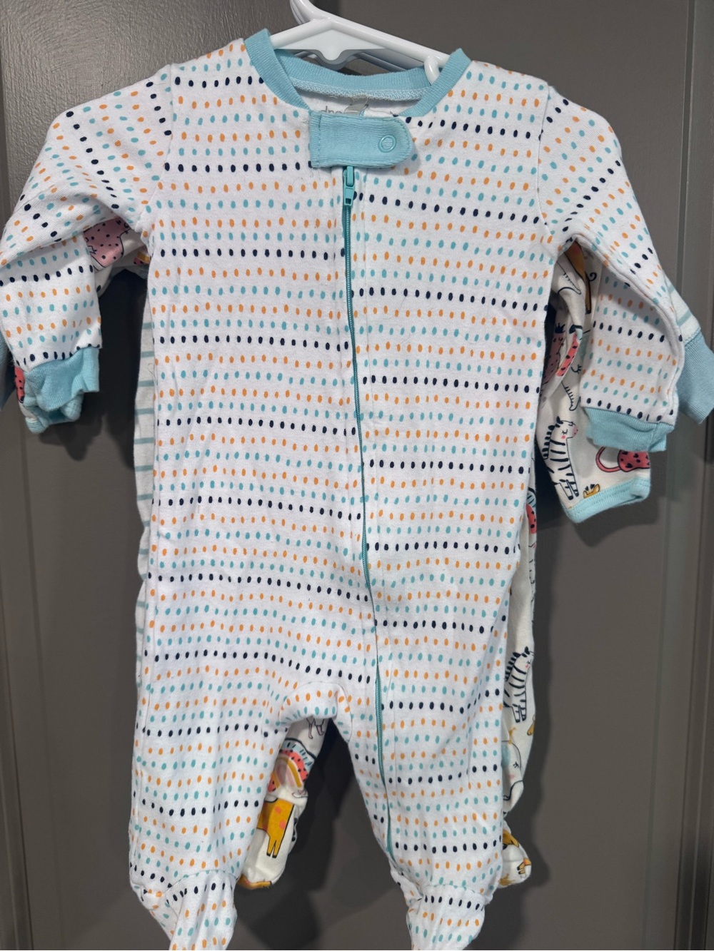 Three piece lot of light weight footed Pajamas, gender neutral.